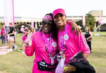 a couple of women standing next to each other